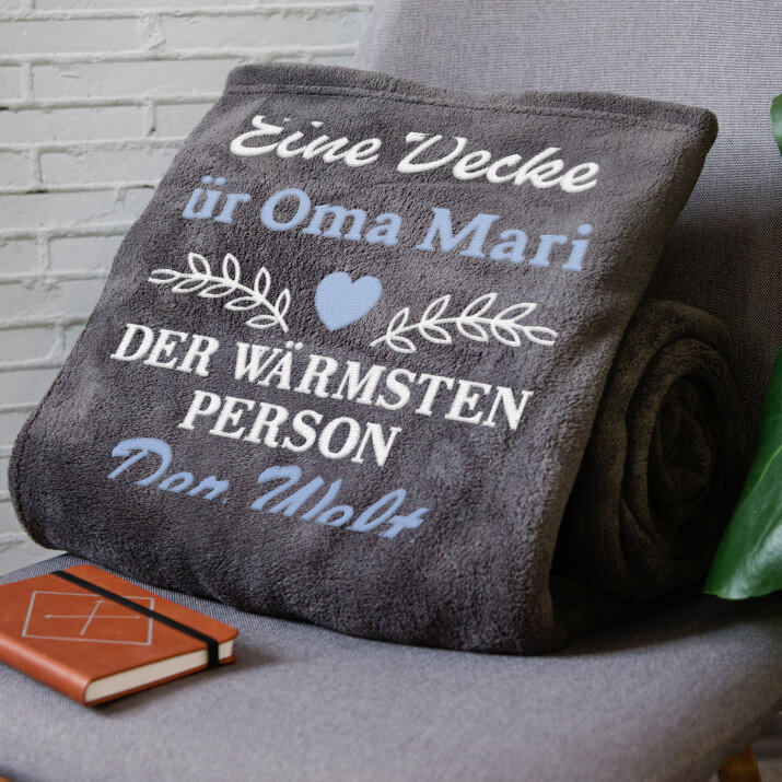 Die wärmste Person der Welt - Decke mit Stickerei